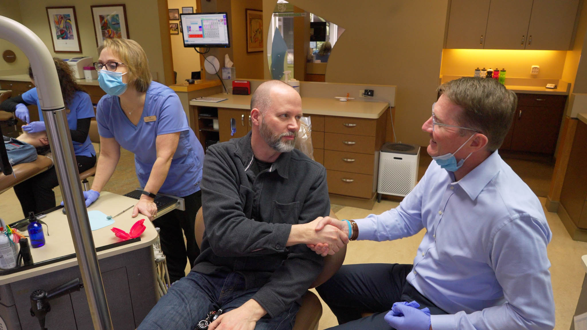 Shaking hands with Dr. Roos - Roos Orthodontics