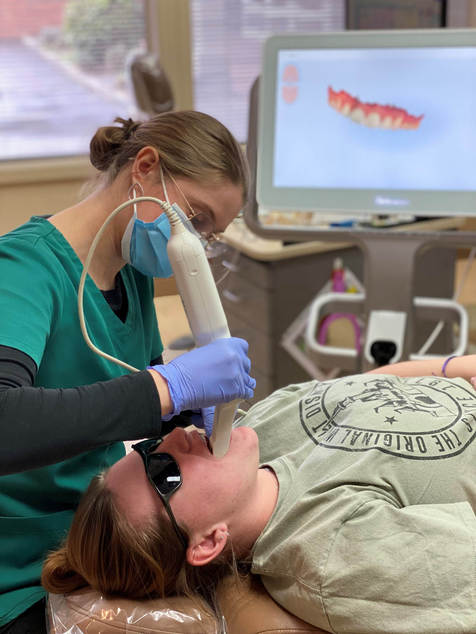 Mari using the iTero scanner at Roos Orthodontics